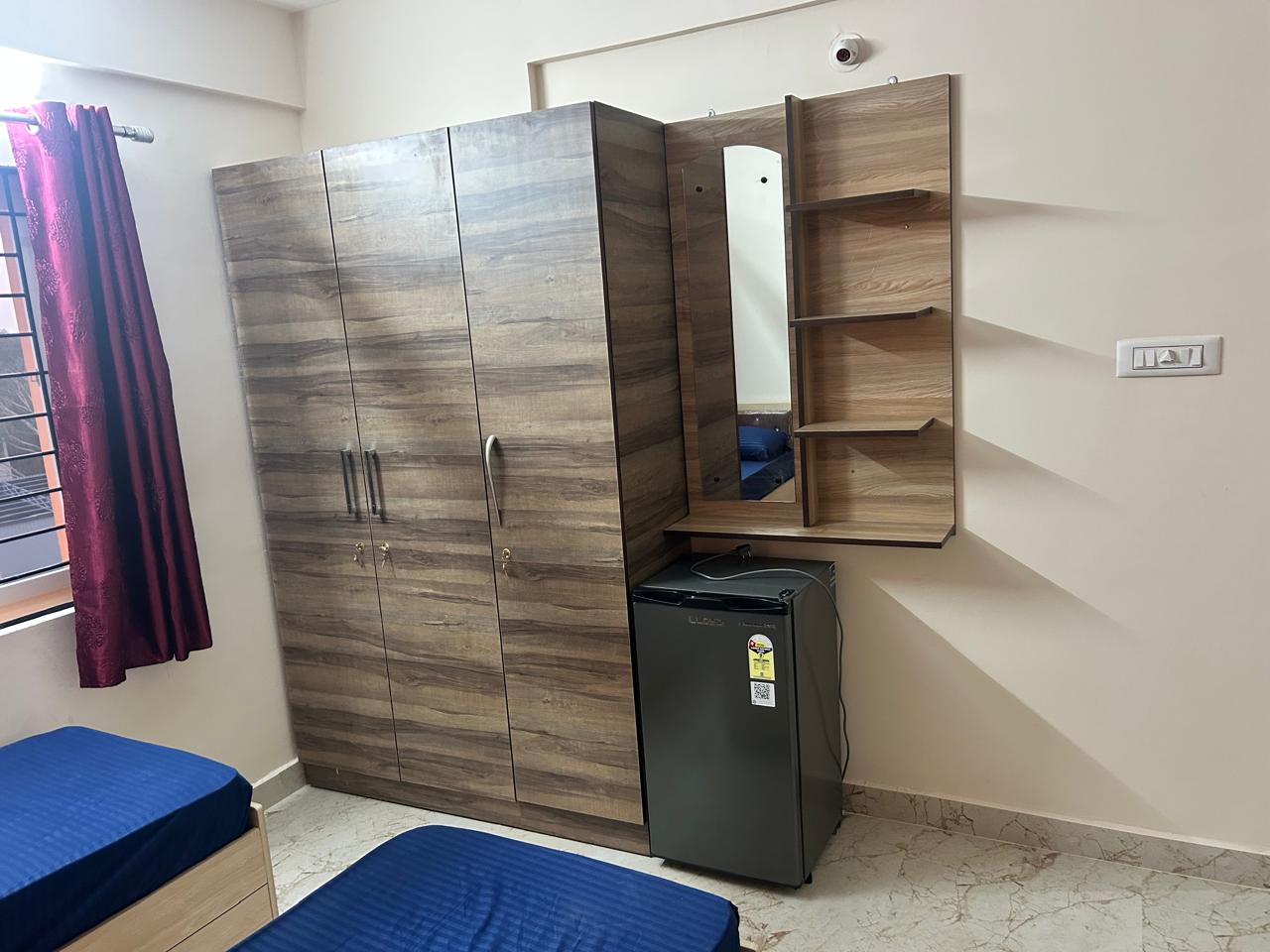 Rest and Roam Co-Live wardrobe fridge CCTV room