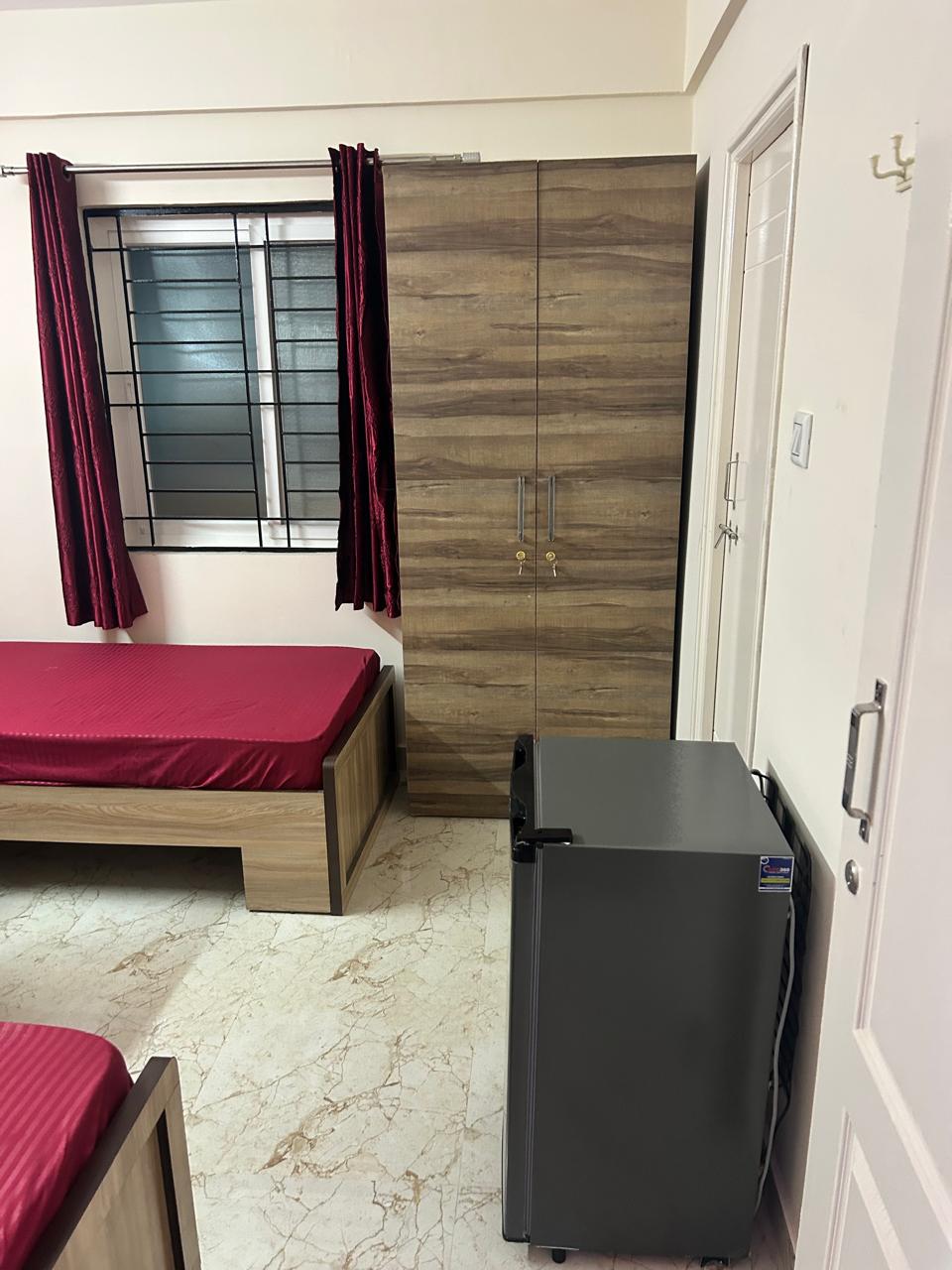 Rest and Roam Co-Live wardrobe and fridge